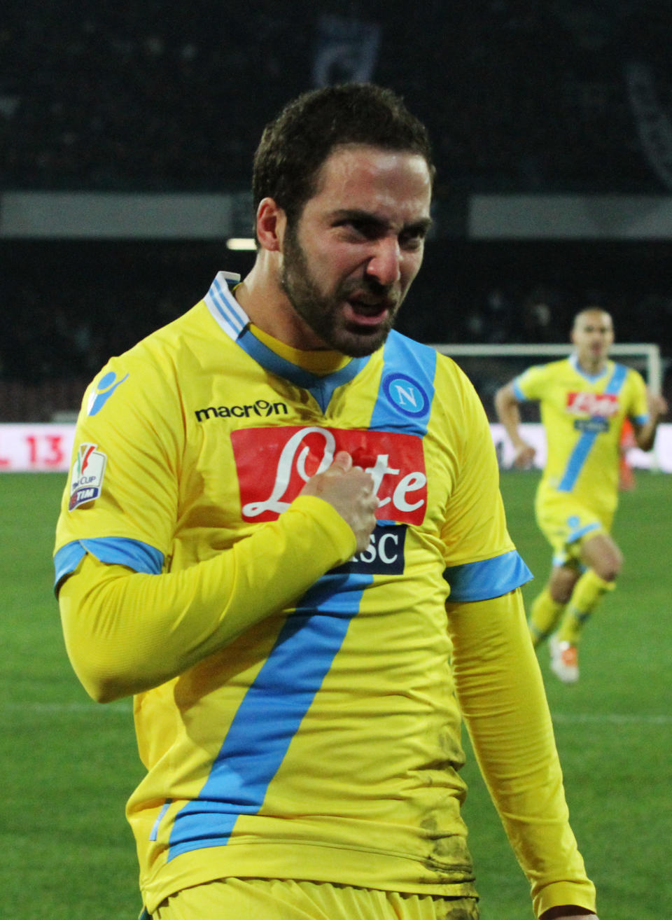 Napoli's Gonzalo Higuain celebrates after scoring during an Italian Cup, semifinal return match, between AS Roma and Napoli, at the San Paolo stadium in Naples, Italy, Wednesday, Feb. 12, 2014. (AP Photo/Salvatore Laporta)