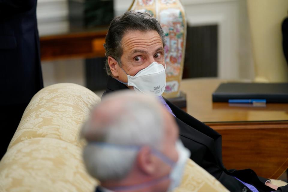 New York Gov. Andrew Cuomo attends a meeting with President Joe Biden and a bipartisan group of mayors and governors to discuss a coronavirus relief package, in the Oval Office of the White House, Friday, Feb. 12, 2021, in Washington.