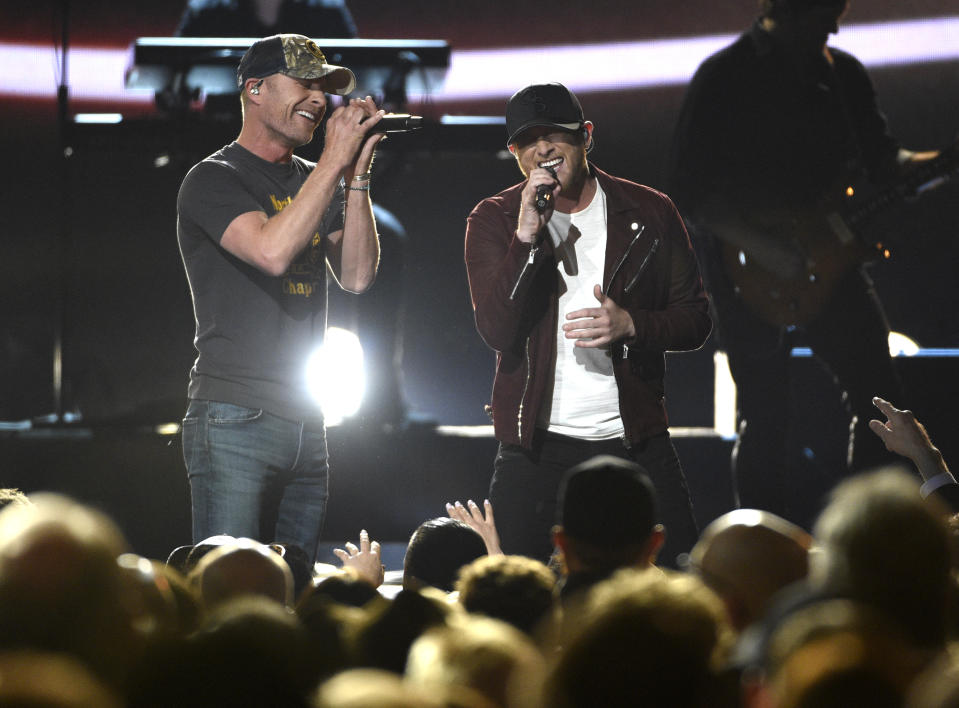 Dierks Bentley, left, and Cole Swindell perform "Flatliner" at the 52nd annual Academy of Country Music Awards at the T-Mobile Arena on Sunday, April 2, 2017, in Las Vegas. (Photo by Chris Pizzello/Invision/AP)