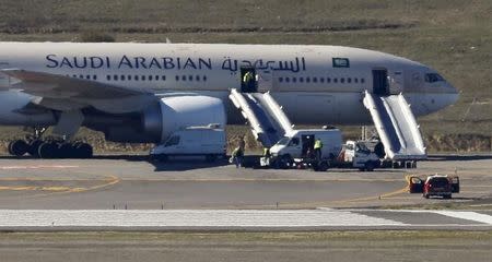 Saudi Arabian Airlines flight SVA 226 is isolated on the tarmac after its passengers and crew were evacuated following a bomb threat, at the Barajas airport in Madrid, Spain, February 4, 2016. REUTERS/Sergio Perez