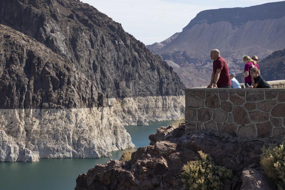 <span class="caption">Lake Mead’s ‘bathtub ring’ shows how far the giant reservoir on the Colorado River had dropped by mid-2021.</span> <span class="attribution"><a class="link " href="https://www.gettyimages.com/detail/news-photo/the-white-bathtub-ring-around-lake-mead-shows-the-record-news-photo/1233759073?adppopup=true" rel="nofollow noopener" target="_blank" data-ylk="slk:David McNew/Getty Images;elm:context_link;itc:0;sec:content-canvas">David McNew/Getty Images</a></span>