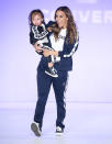 <p>The country crooner and daughter Jolie Rae, 2, who was making her modeling debut, walked the runway and waved to their fans during the 2018 Rookie USA Show in L.A. (Photo: Michael Tran/Getty Images) </p>