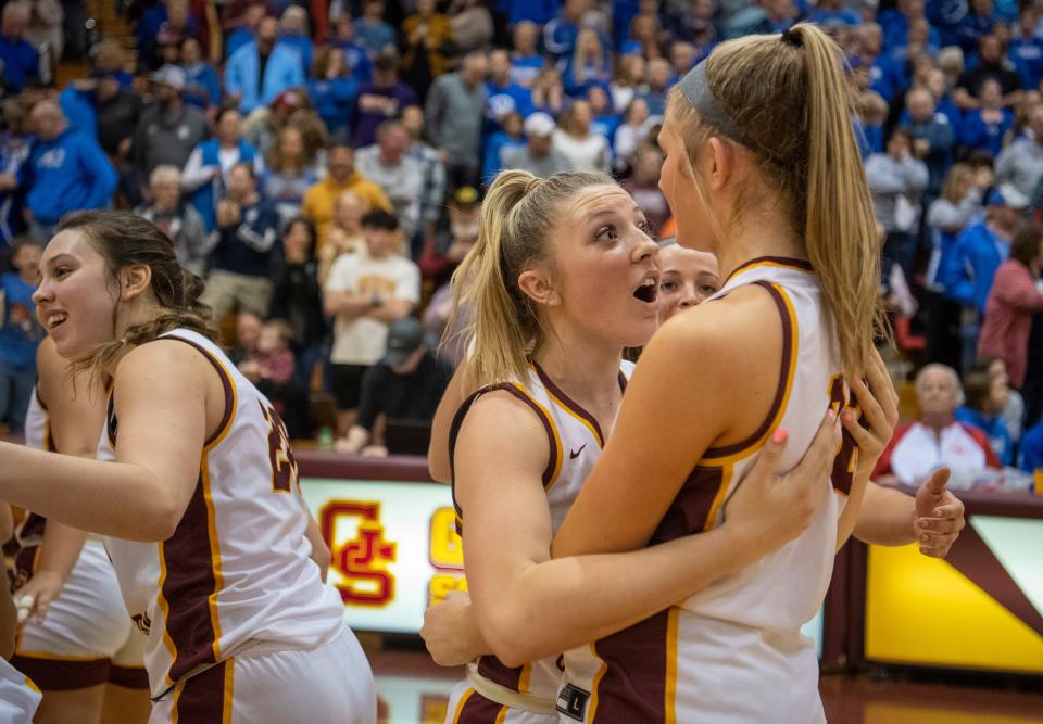 Gibson Southern’s Gabby Spink (15) and Paige Schnaus (32) celebrate their win over the Memorial Tigers during the semifinal round of the 2024 Class 3A Girls Basketball Sectional 32 at Gibson Southern High School Friday, Feb. 2, 2024.