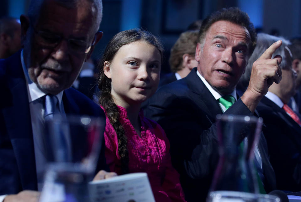 Former California Governor Arnold Schwarzenegger reacts next to Swedish climate activist Greta Thunberg and Austrian President Alexander Van der Bellen during the R20 Austrian World Summit in Vienna, Austria, May 28, 2019. REUTERS/Lisi Niesner