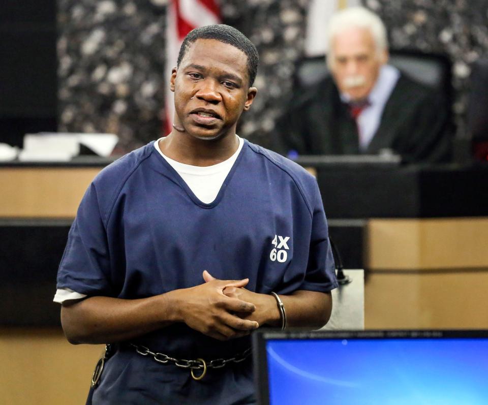 Tears run down Carl Booth's face as he apologizes to the family of Norman "Pooh" Griffith in court Friday, January 15, 2015. Booth, convicted of the 2008 shooting death of Griffith, is being resentenced under a new state law that requires juveniles to be given special consideration before they can be handed life sentences.