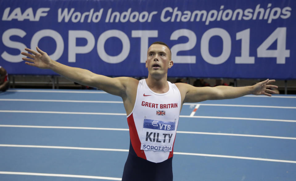 Britain's Richard Kilty celebrates winning the gold in the men's 60m final during the Athletics Indoor World Championships in Sopot, Poland, Saturday, March 8, 2014. (AP Photo/Matt Dunham)
