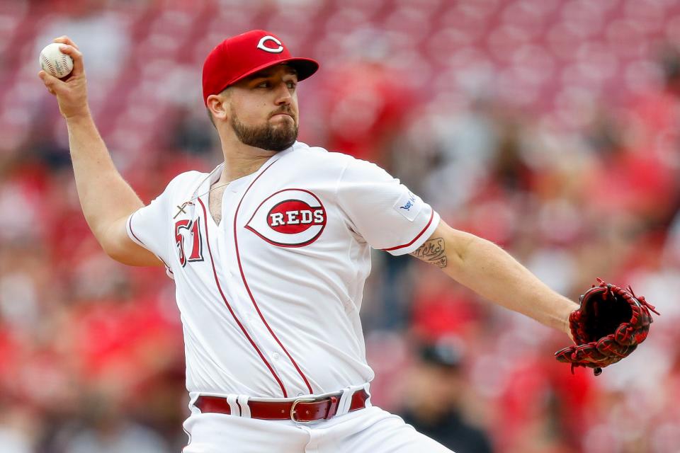 Cincinnati Reds starting pitcher Graham Ashcraft (51) pitches against the Chicago White Sox in the first inning at Great American Ball Park on Sunday.