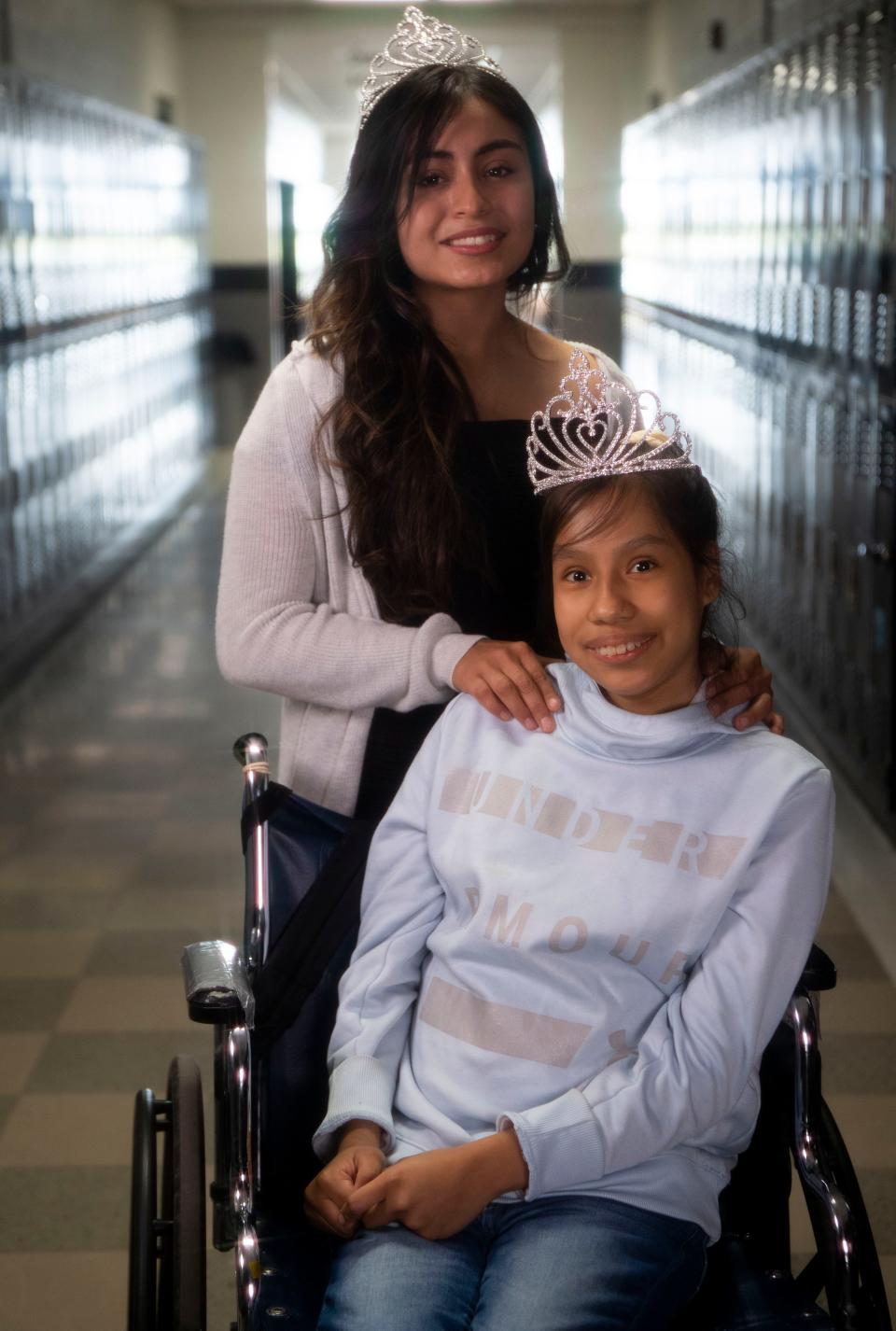 Former homecoming queen Juleydi Franco Ramos stands next to the new homecoming queen, Liliana Pahuamba Roque at Crossville High School  in Crossville, Alabama, Thursday, Nov. 3, 2022.