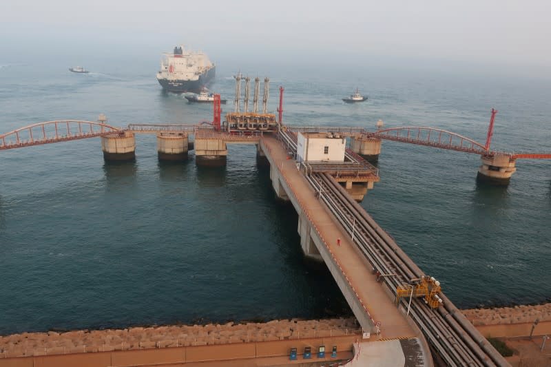 FILE PHOTO: A liquified natural gas (LNG) tanker leaves the dock after discharge at PetroChina's receiving terminal in Dalian