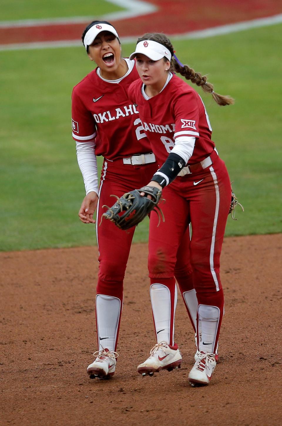 OU's Avery Hodge (82) celebrates an out with Tiare Jennings (23) in the first inning against Houston on April 20 at Love's Field in Norman.