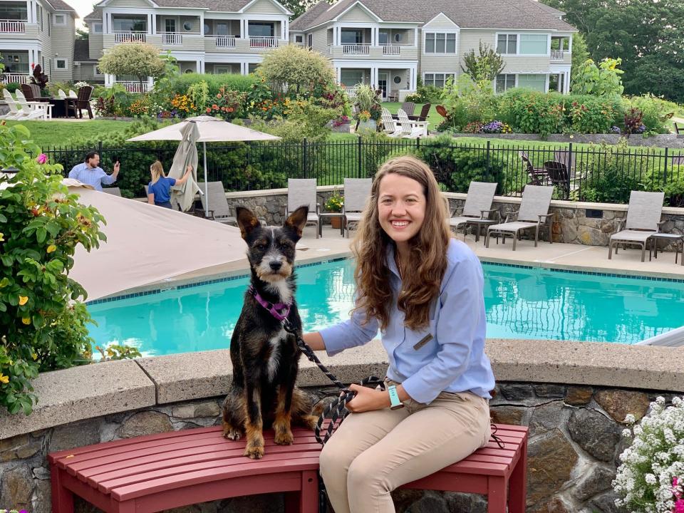 A foster dog with staff at The Inn by the Sea in Cape Elizabeth, Maine. The Inn fosters shelter dogs from the Animal Refuge League of Greater Portland on site, offering them a temporary home until adopted.