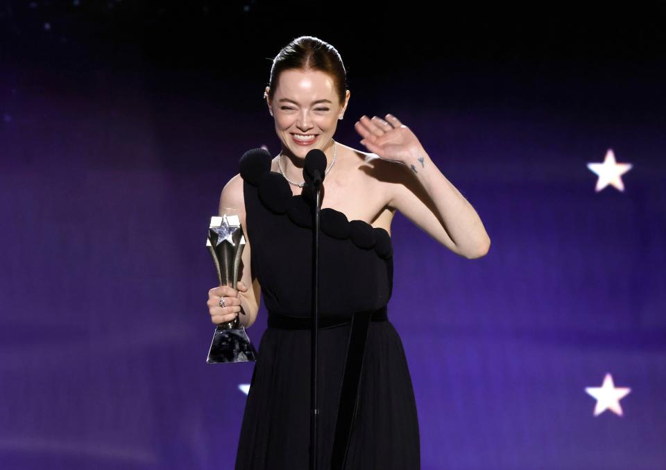 A shocked Emma Stone thanked critics but said she doesn't listen to them after winning best actress for "Poor Things" at the Critics Choice Awards.