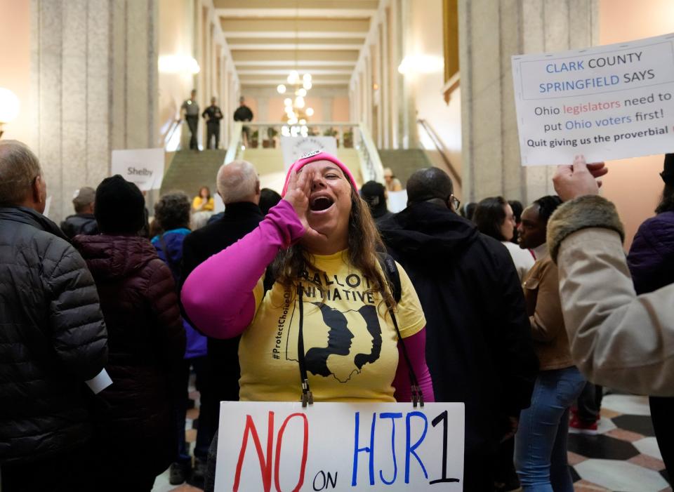 Amy Nachtrab of Delaware County leads chants as demonstrators filed out the rotunda of the Ohio Statehouse on May 3 to protest SJR 2.