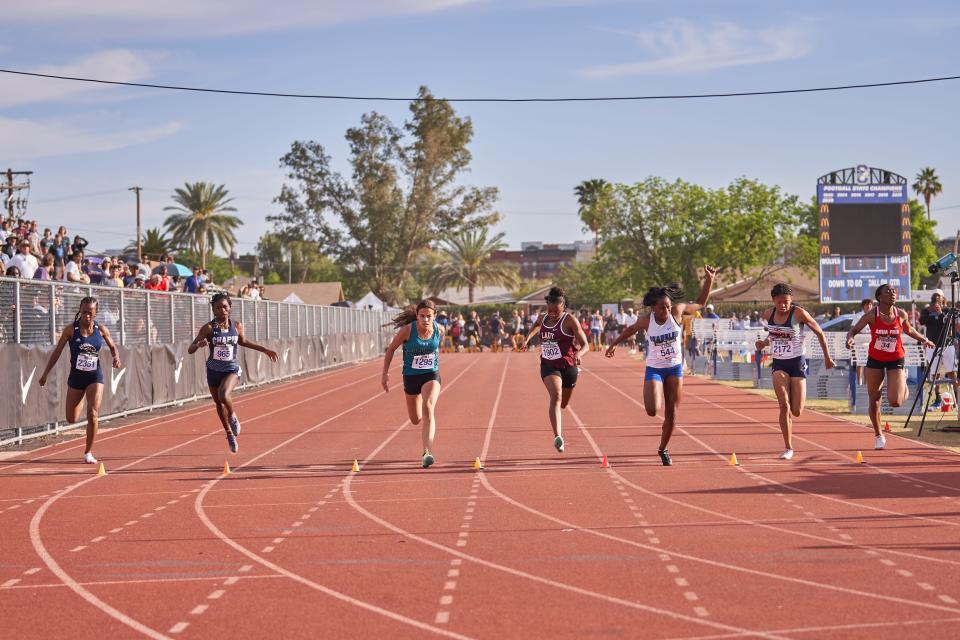 Mar 26, 2022; Chandler, Arizona, USA; The third heat of the Girls 100 Meter Dash during the Chandler Rotary Track Meet at Chandler High School Austin Field track.