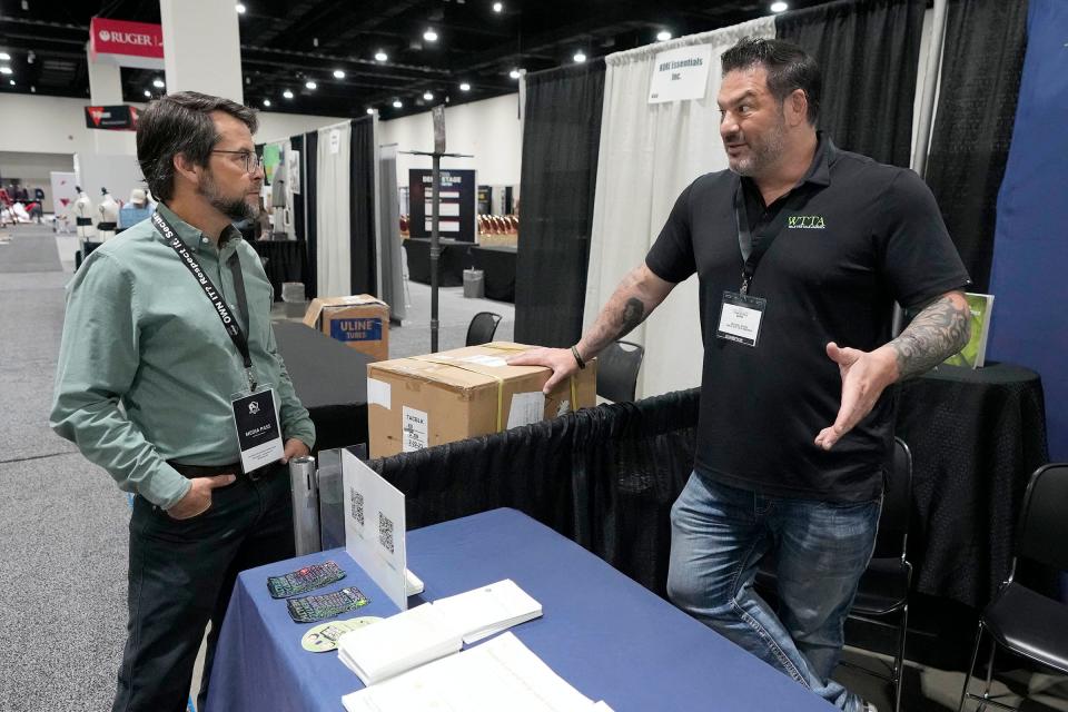 Milwaukee Journal Sentinel reporter John Diedrich interviews Michael Sodini, who used to run a gun importer and started Walk the Talk America to discuss mental health concerns among gun owners, in Milwaukee in September 2023