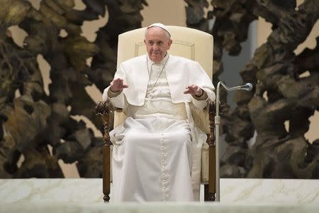 Pope Francis looks on as he leads a special audience for members of UCIIM, Italian catholic association of teachers, school managers, educators and trainers, in Paul VI's hall at the Vatican March 14, 2015. REUTERS/Osservatore Romano