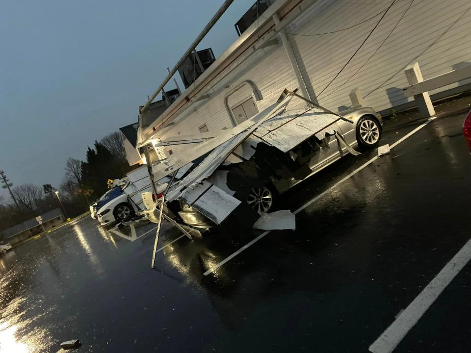 A tornado damaged cars and blew down trees outside the Harvest Seasonal Grill at the Village at Newtown on Saturday night. The National Weather Service confirmed an EF1 tornado blew cut a four mile path through Newtown Township and Borough on Saturday evening