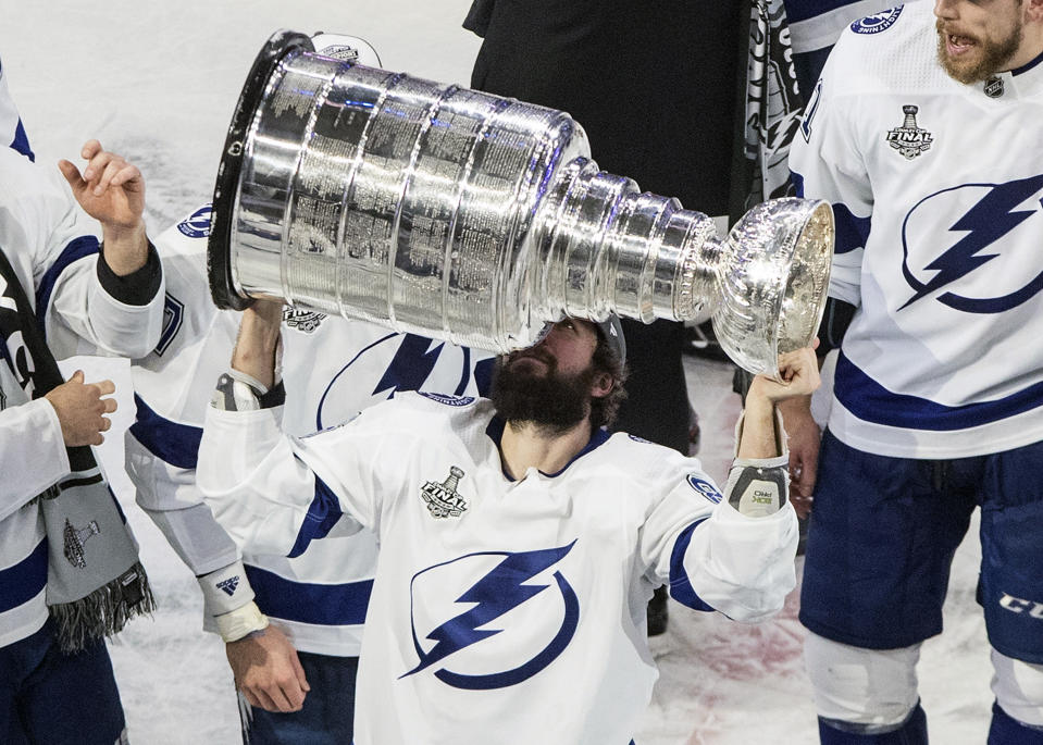 Tampa Bay Lightning's Nikita Kucherov (86) hoists the Stanley Cup after defeating the Dallas Stars in the NHL Stanley Cup hockey finals, in Edmonton, Alberta, on Monday, Sept. 28, 2020. (Jason Franson/The Canadian Press via AP)