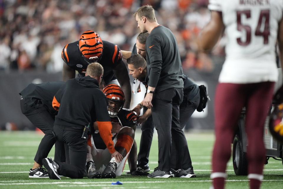 Cincinnati Bengals offensive lineman Trent Brown is attended to against the Washington Commanders on Sept. 23, 2024.