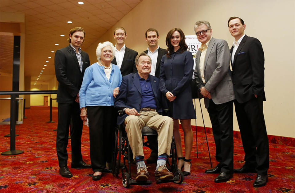 George H.W. Bush and wife Barbara pose with Lind and the case of AMC's 