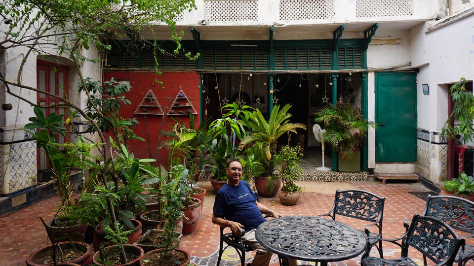 Ajay Parshed sits in the courtyard of his grand 120-room ancestral haveli (traditional house). - Aishwarya S. Iyer/CNN