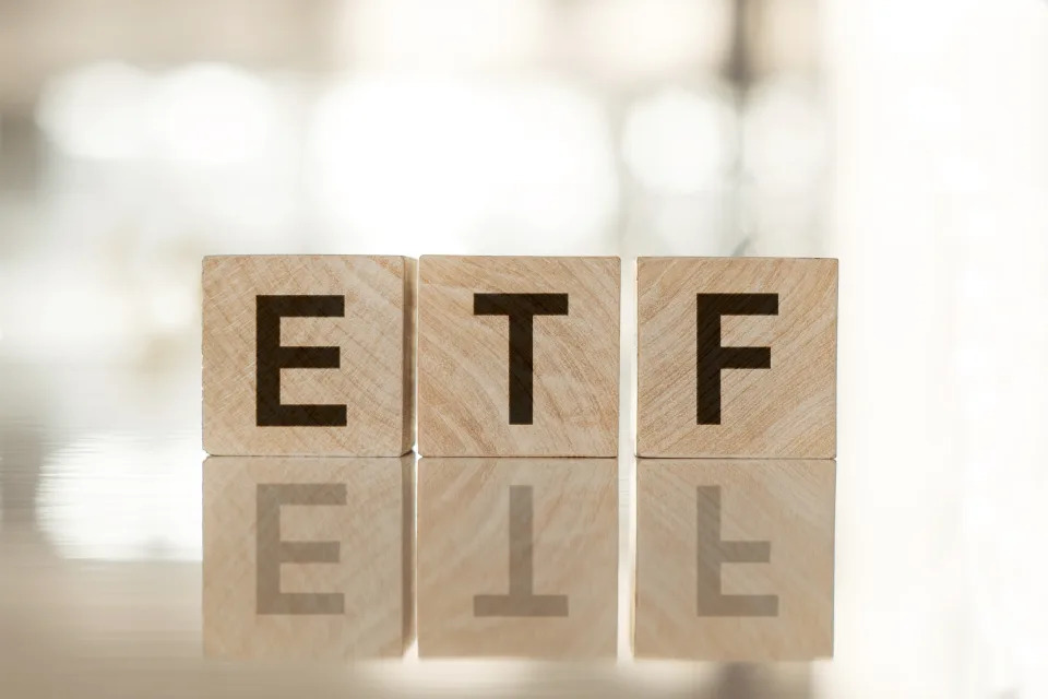 ETF - Exchange Traded Fund text on wooden cubes, on white background