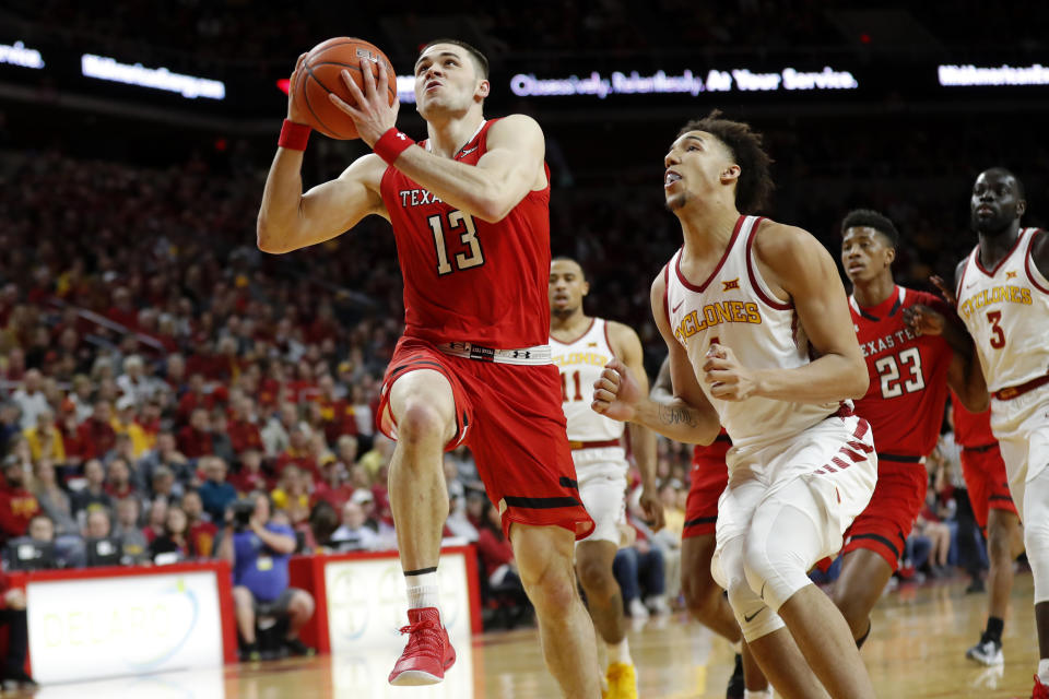 Texas Tech guard Matt Mooney (13) drives to the basket ahead of Iowa State forward George Conditt IV during the first half of an NCAA college basketball game, Saturday, March 9, 2019, in Ames, Iowa. (AP Photo/Charlie Neibergall)