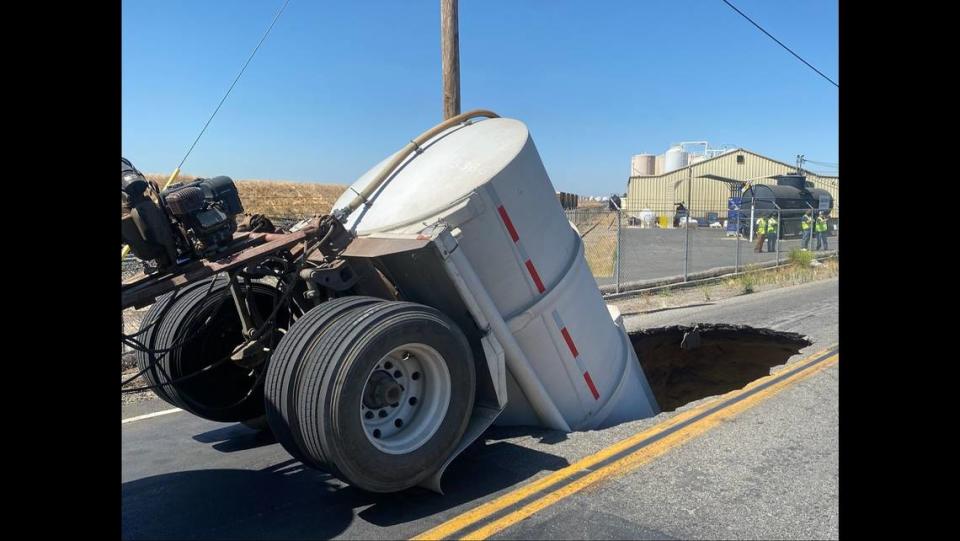 A trailer being pulled by a truck fell into a sinkhole about 10:25 a.m. Monday, June 10, 2024, in Madera, according to the California Highway Patrol.