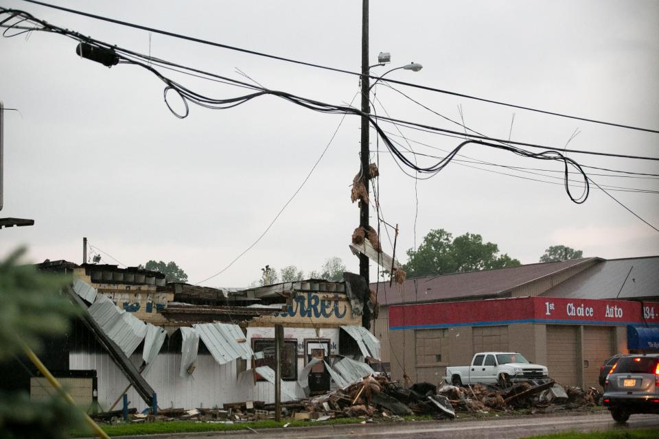 Siding ripped of the side of the building at 2027 Velp Avenue due to storm damage on Wednesday in Howard.