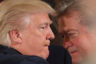 President Donald Trump talks to senior staff Steve Bannon during a swearing in ceremony for senior staff at the White House in Washington, DC January 22, 2017. REUTERS/Carlos Barria