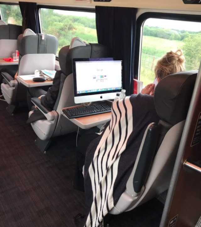 Commuters surprised as woman brings desktop onto train