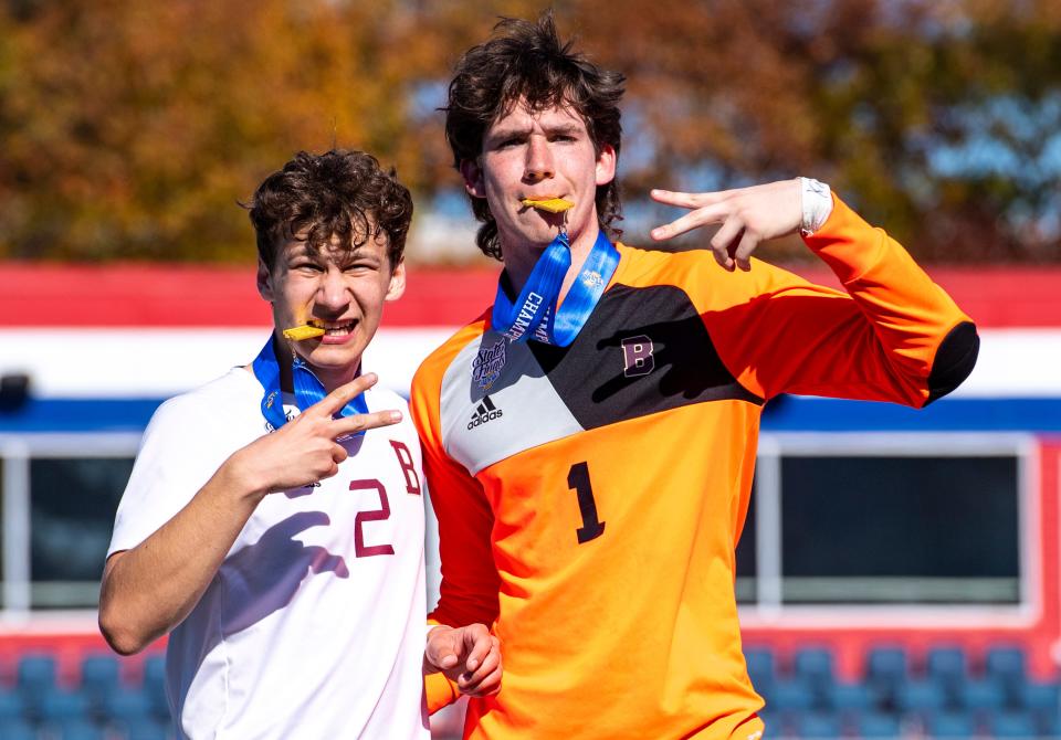 Brebeuf Jesuit Preparatory High School senior Aidan Wade (1) and junior Teddy Potts (2) celebrate after winning an IHSAA Class 2A boys’ soccer State Championship match against Mishawaka Marian High School, Saturday, Oct. 29, 2022, at IUPUI’s Michael A. Carroll Track and Soccer Stadium in Indianapolis.