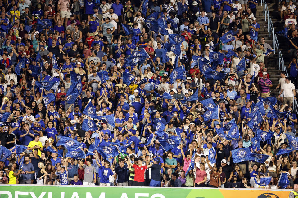 Chelsea fans celebrate the team's goal against Wrexham during the second half of a club friendly soccer match Wednesday, July 19, 2023, in Chapel Hill, N.C. (AP Photo/Karl B DeBlaker)