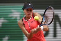 Poland's Magda Linette plays a shot against Tunisia's Ons Jabeur during their first round match at the French Open tennis tournament in Roland Garros stadium in Paris, France, Sunday, May 22, 2022. (AP Photo/Christophe Ena)
