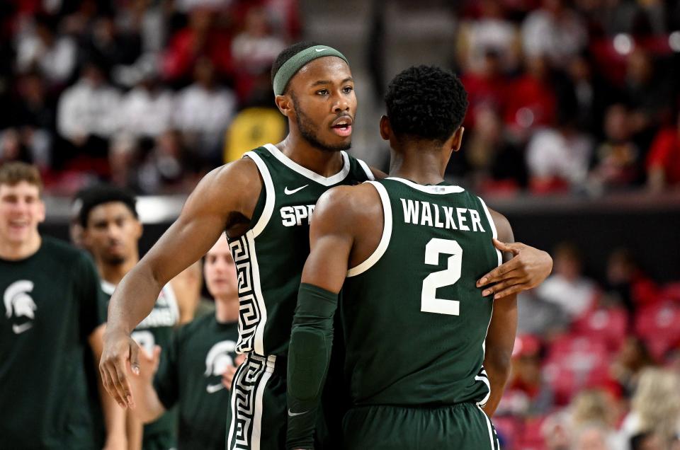 Michigan State guard Tre Holloman, left, celebrates with Tyson Walker in the second half of MSU's 61-59 win on Sunday, Jan. 21, 2024, in College Park, Maryland.
