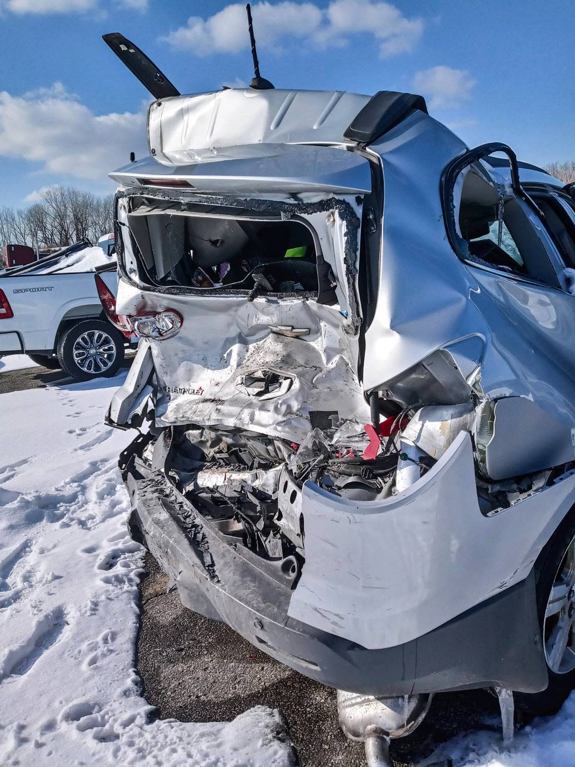 The severely damaged car 5-year-old Ariel Young was in when then-Chiefs linebacker coach Britt Reid slammed his pickup truck into it days before the Super Bowl sat in a snow-covered impound lot shortly after the wreck.