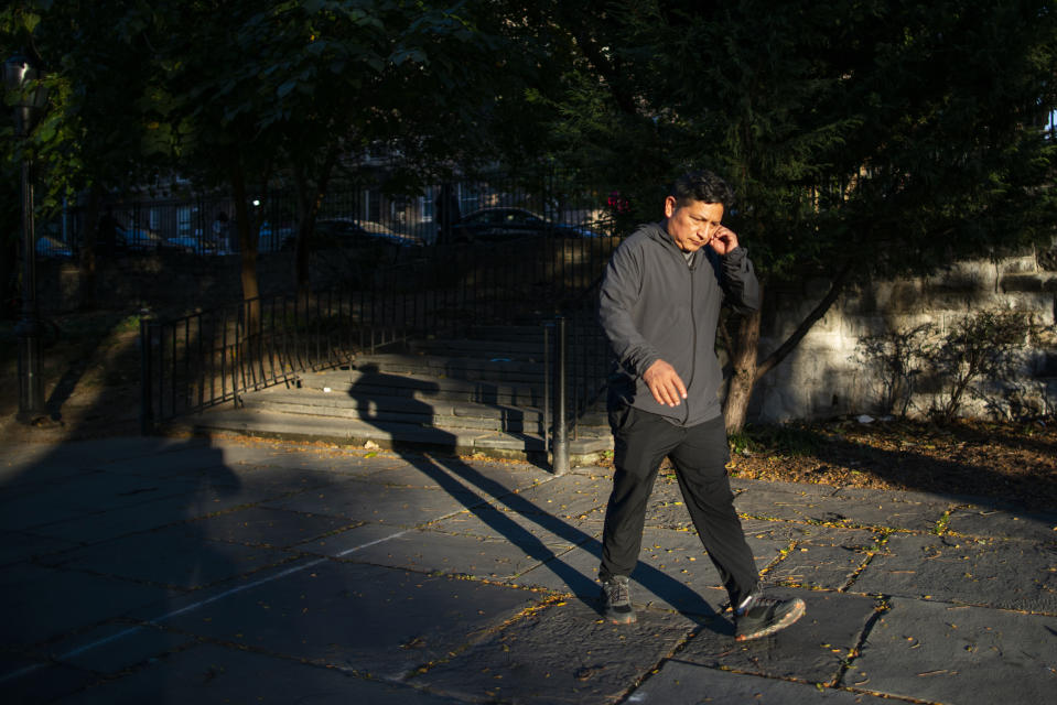Ecuadorian immigrant Neptali Chiluisa walks around the borough of Bronx on Thursday, Oct. 21, 2021, in New York. (AP Photo/Eduardo Munoz Alvarez)