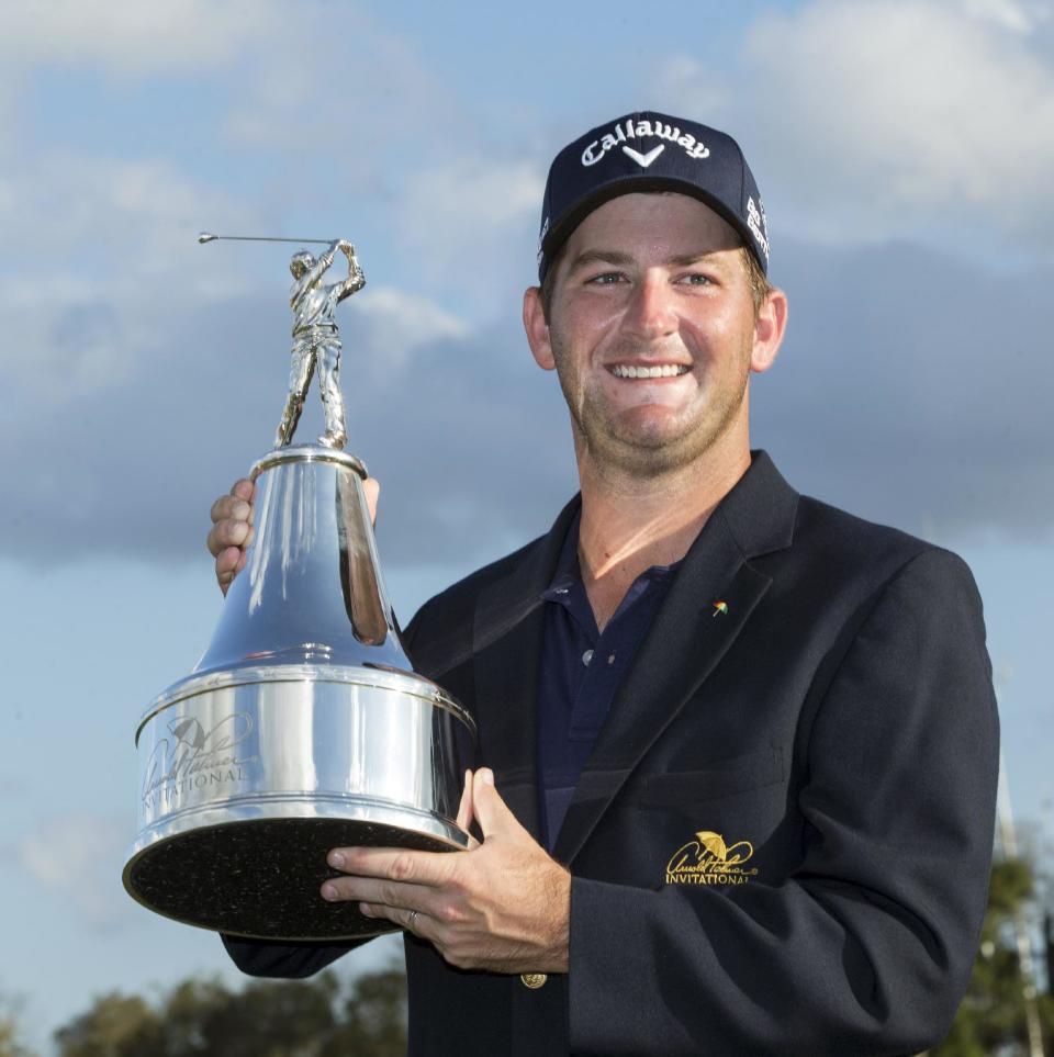 Matt Every holds the trophy after winning the Arnold Palmer Invitational golf tournament at Bay Hill, Sunday, March 23, 2014, in Orlando, Fla. (AP Photo/Willie J. Allen Jr.)