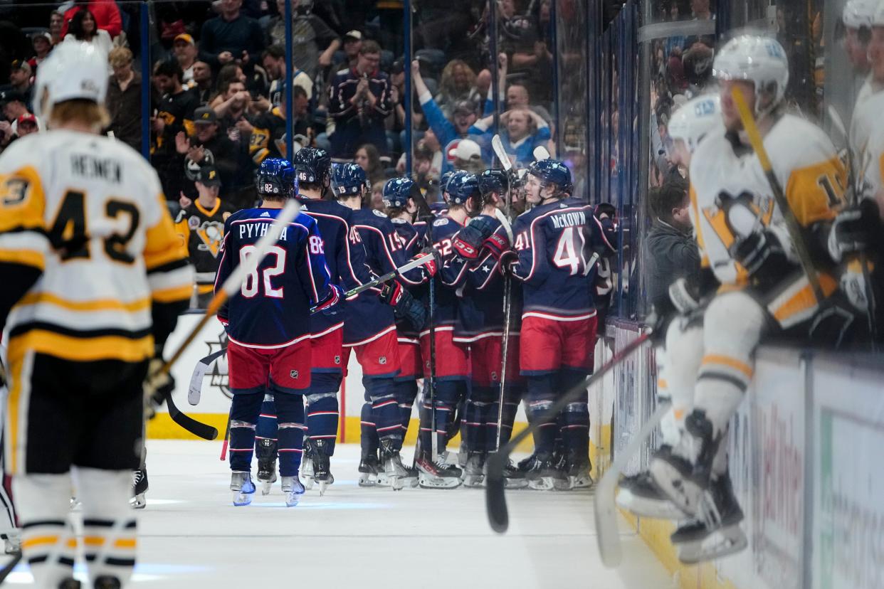 Columbus Blue Jackets celebrate the game-winning goal by left wing Johnny Gaudreau (13) during the overtime of the NHL hockey game against the Pittsburgh Penguins at Nationwide Arena on April 13, 2023. The Blue Jackets won 3-2.