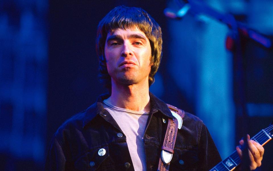 Noel Gallagher with Oasis at Wembley, 2000