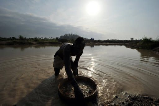 A diamond prospector filters earth from a river in April 2012 in Koidu, capital of the diamond-rich Kono district, eastern Sierra Leone. In one of the most notorious cases, former Liberian president Charles Taylor was accused by an international court of being paid in diamonds worth millions by Sierra Leone rebels -- some stuffed into mayonnaise jars