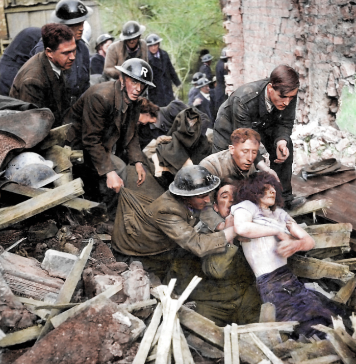 <p>Rescuers with an ‘R’ on their helmets pull a bomb victim from the rubble. (MediaDrumWorld) </p>