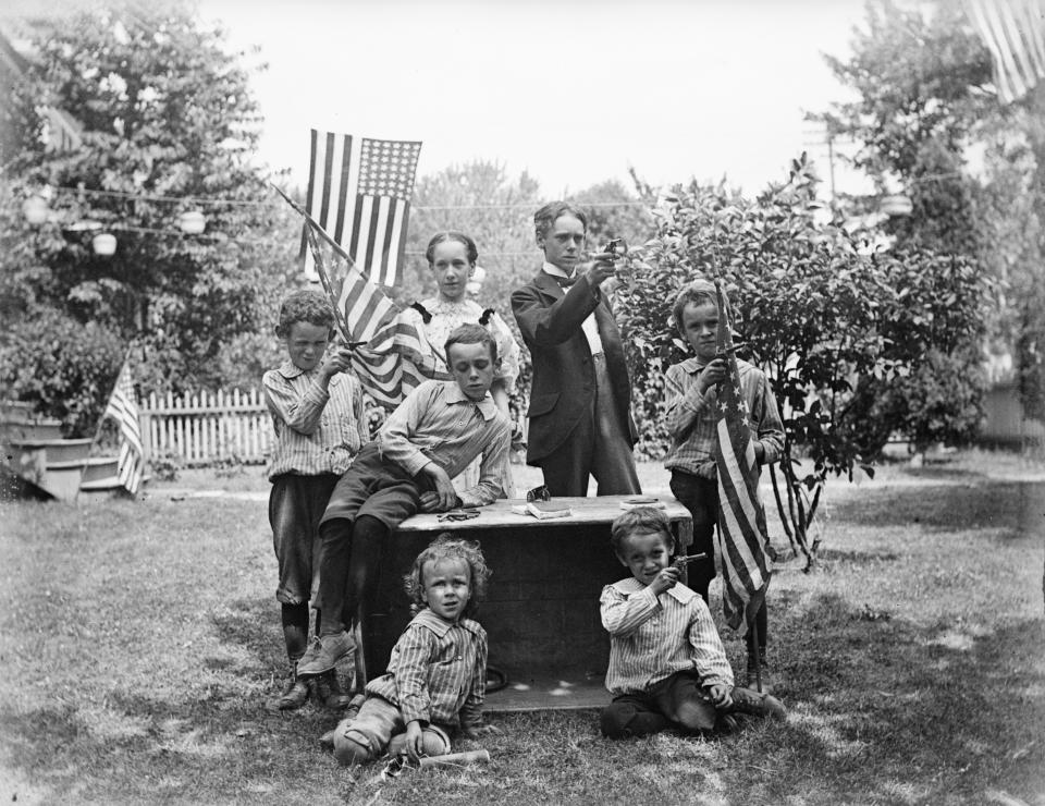 <p>Family with pistols and flags get ready for their Fourth of July celebration, circa 1880s (Photo: Bettmann Archive/Getty Images) </p>