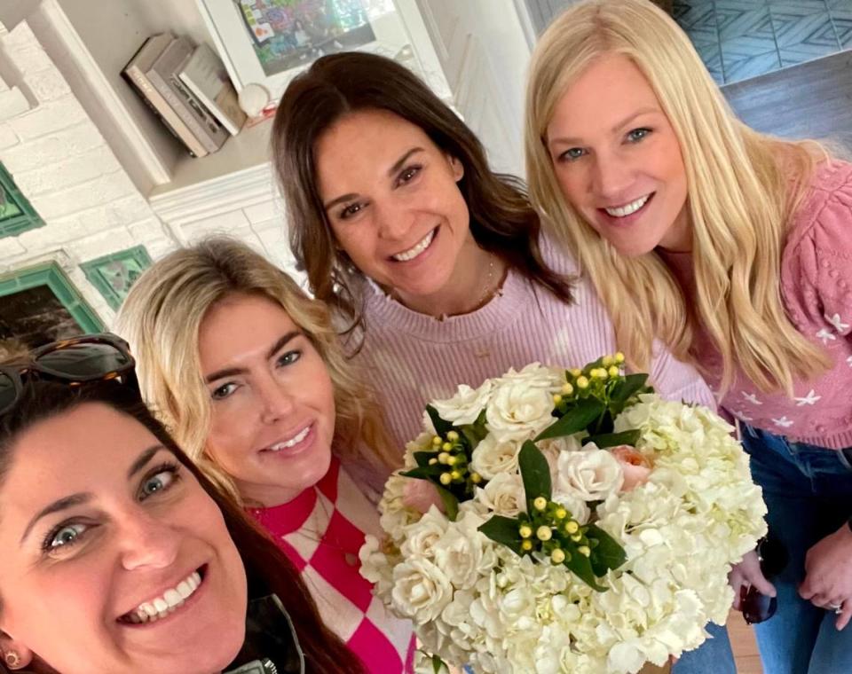 Amanda Hewitt, second from right, with the friends who made the Valentine’s Day delivery to her in 2023.