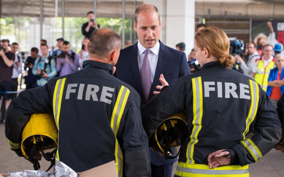 The Duke of Cambridge meets firefighters during a visit to the Westway Sports Centre, London - Credit: Dominic Lipinski/PA