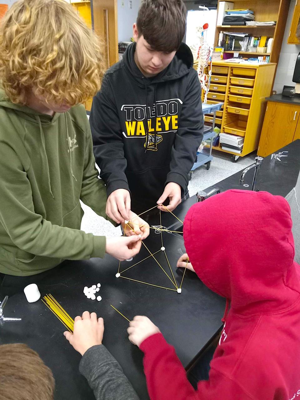 Hiland High School students construct a tower using marshmallows, spaghetti, string and tape as part of a demonstration on not being afraid to fail.