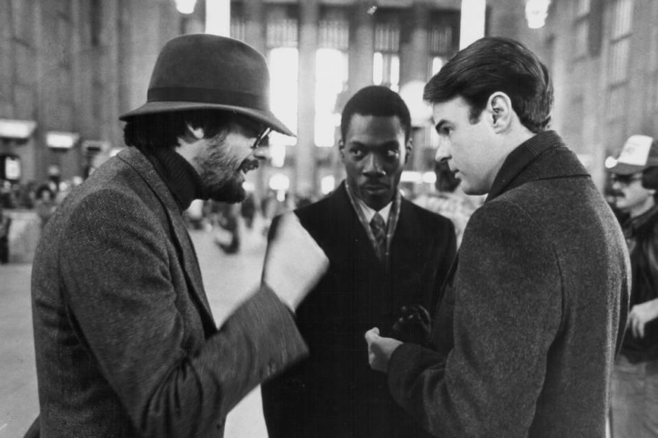 John Landis with Eddie Murphy and Dan Aykroyd on the set of "Trading Places"