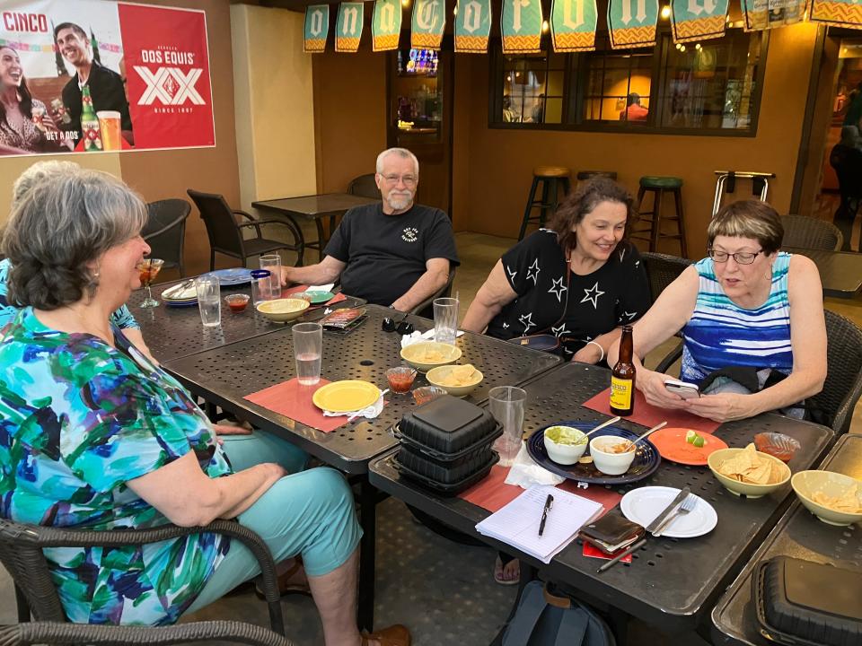 Members of the Central Arizona Tall Society swap stories at gathering on April 25, 2023.