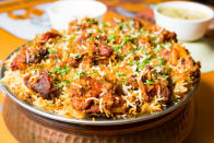 <p>The Nizam of Hyderabad was an ex-patriot Mughal. So the Hyderbadi biryani is a mixture of the original Mughlai style biryani and the Southern, particularly Andhra cuisine. It is extremely spicy and rich. </p>