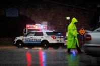 A police officer walks near an area where an explosive device left at a train station was detonated by the authorities in Elizabeth, New Jersey, U.S., September 19, 2016. REUTERS/Eduardo Munoz